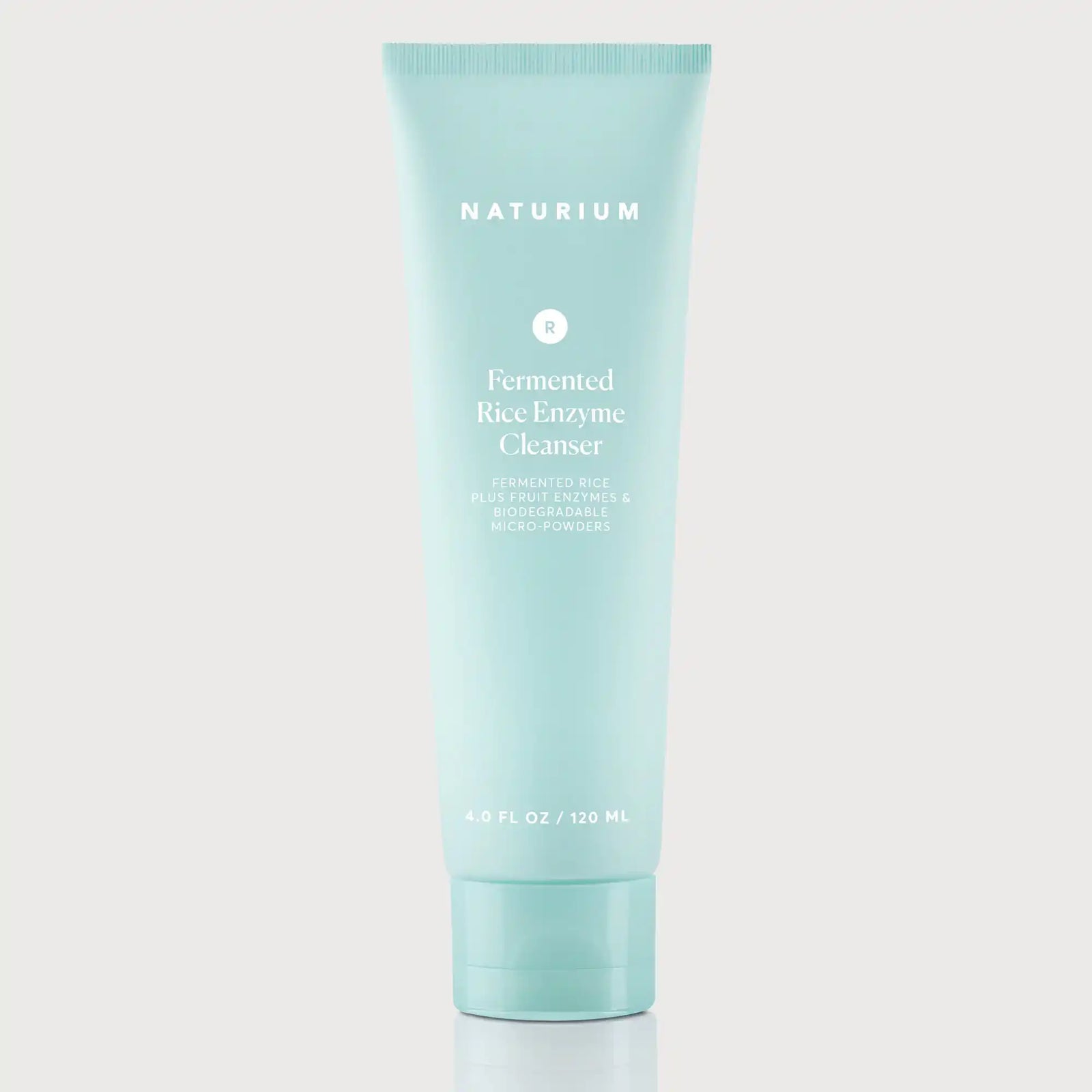 Naturium Fermented Rice Enzyme Cleanser powder in a plain white jar, unbranded background, showing dry rice ferment format