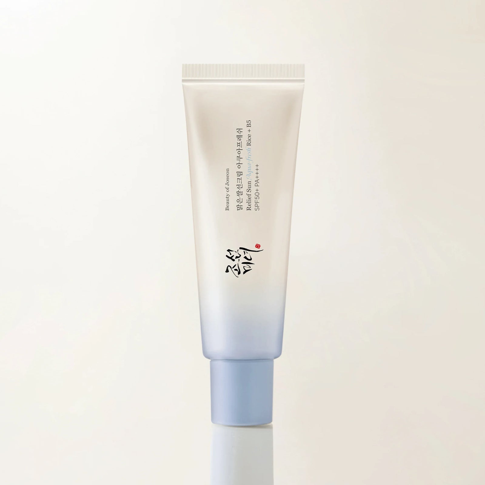 Blue tube of Beauty of Joseon Relief Sun Rice and B5 chemical sunscreen SPF 50 PA++++ against a white background.