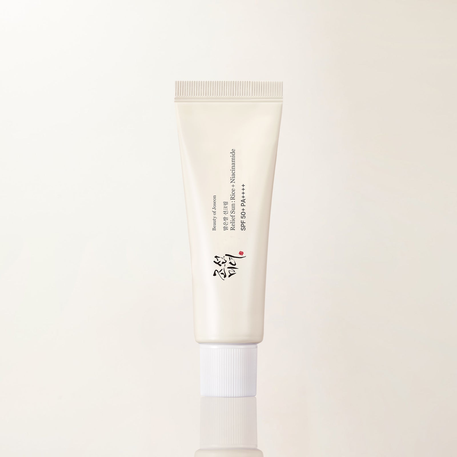 Beauty of Joseon Relief Sun Rice and Niacinamide SPF 50+ PA++++ 50 mL sunscreen bottle, cream colored packaging on a plain background